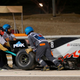 Illustration for article titled Haas Driver Romain Grosjeans F1 Car Goes Up In Flames, Spears Through Barrier, Splits In Half. Grosjean Walks Away